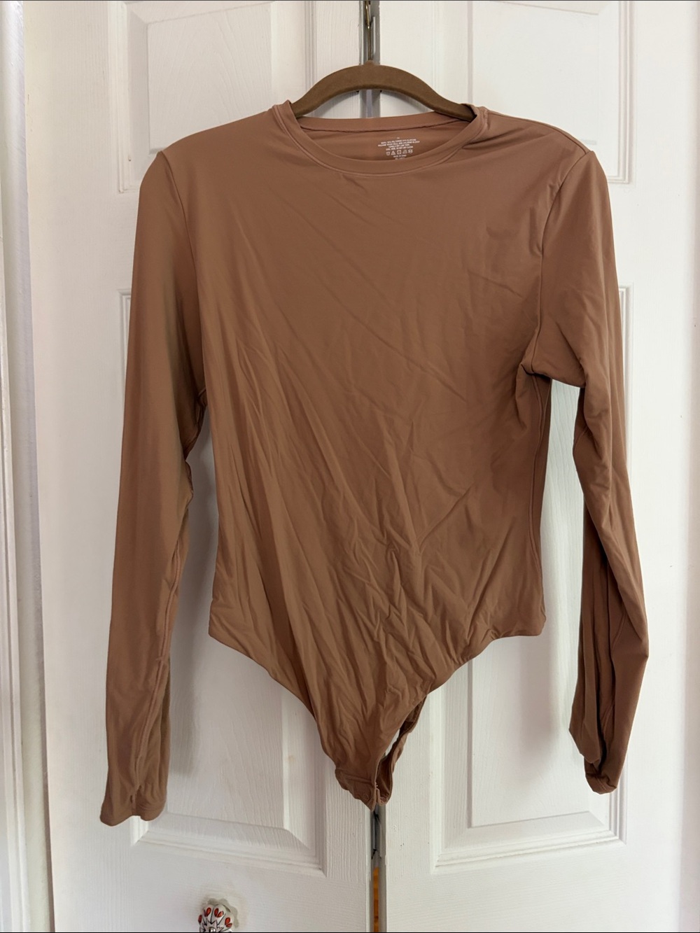 SKIMS Long Sleeve Bodysuit in Brown